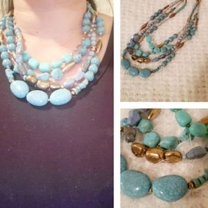 Turquoise colored multi strand necklace